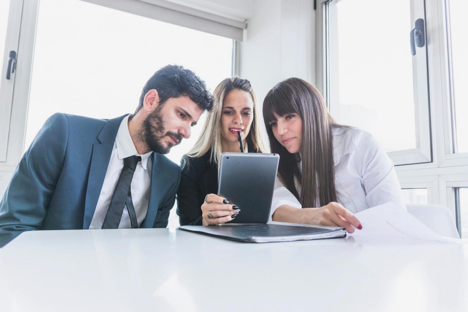 Strategic planning session with financial documents and charts